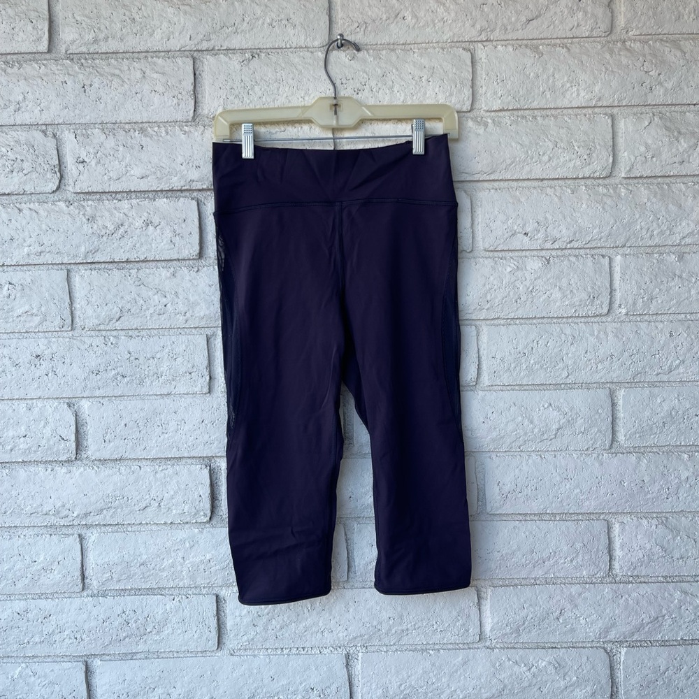 Purple Lululemon leggings with mesh siding